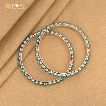 925 sterling silver bangle with turquoise stone by Tribal Ornaments, showcasing intricate design and vibrant blue gemstone.