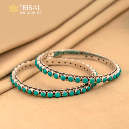Sterling silver turquoise stone bangle by TRIBAL ORNAMENTS, featuring a vibrant turquoise inlay and crafted with pure silver jewelry.