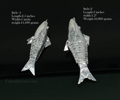 Solid silver Lord Vishnu Matsya fish pendant from Tribal Ornaments, symbolizing prosperity and good luck, handmade art piece.