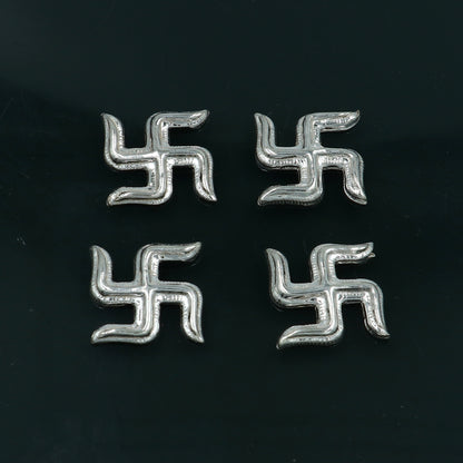Tribal Ornaments 925 sterling silver Swastika Diwali pooja set with two decorative symbols for religious rituals.