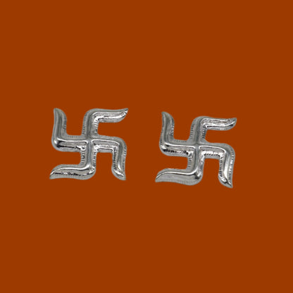 Two 925 sterling silver swastika symbols from Tribal Ornaments' Diwali pooja set, traditional silver religious decor.