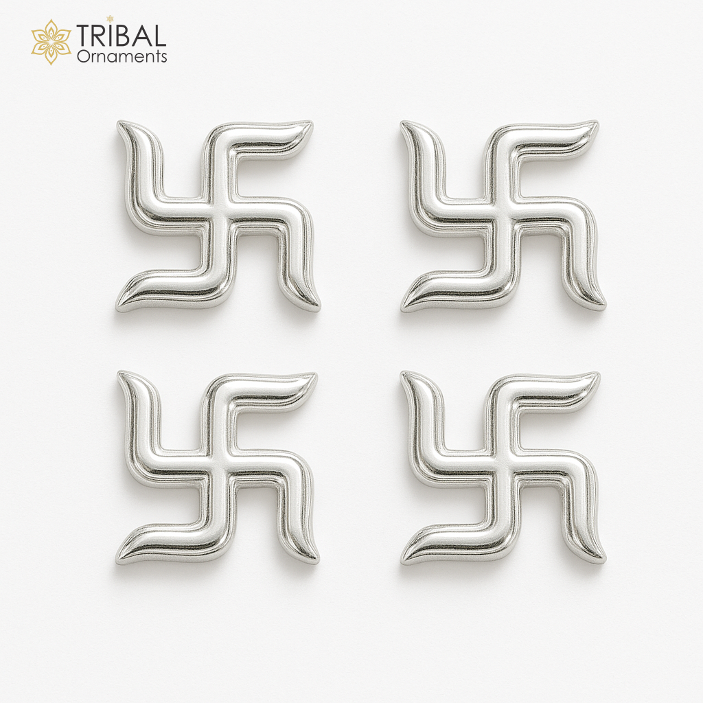 Two 925 sterling silver swastika symbols from Tribal Ornaments' Diwali pooja set, handcrafted for traditional religious rituals.