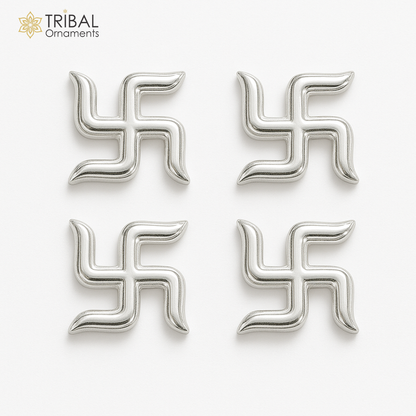 Two 925 sterling silver swastika symbols from Tribal Ornaments' Diwali pooja set, handcrafted for traditional religious rituals.