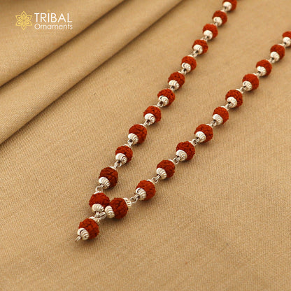 Handmade silver bead chain necklace with natural Rudraksha beads, unisex tribal jewelry by TRIBALORNAMENT showcasing an intricate design.