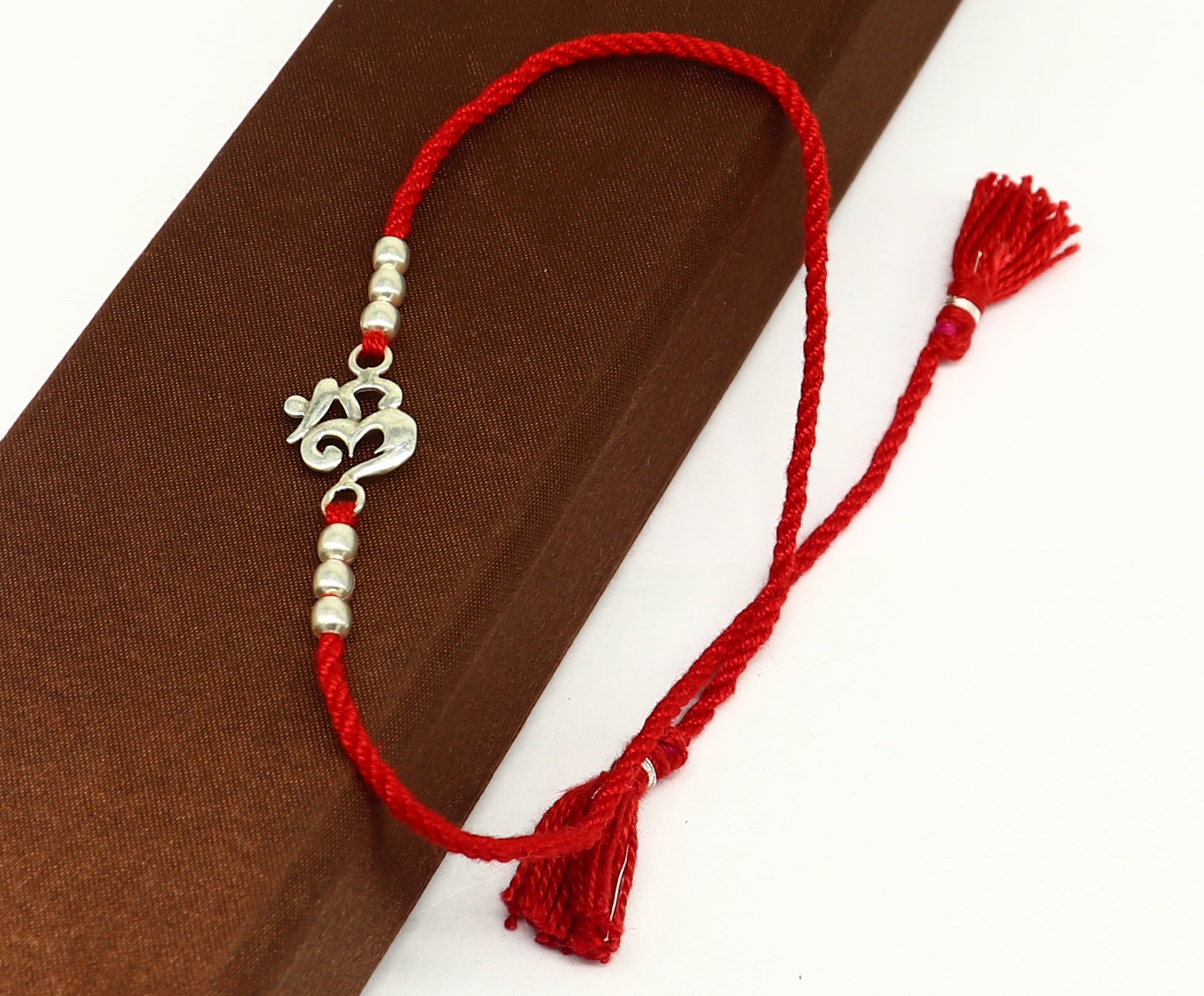 925 sterling silver custom design fabulous symbol OM or AUM design Rakhi bracelet with red thread Best sibling rakhi rk174 - TRIBAL ORNAMENTS