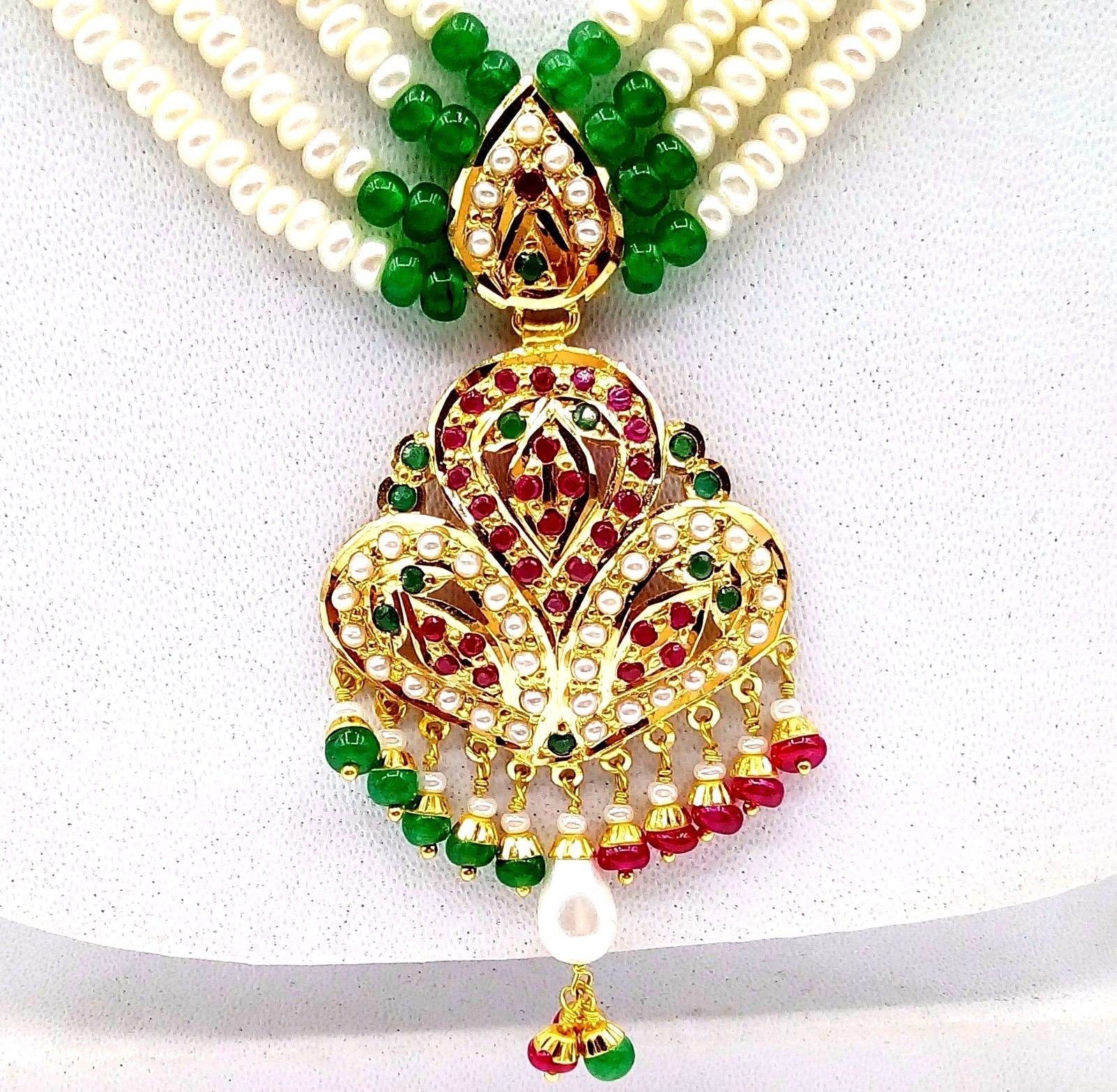 Solid 10k gold with popular mother of pearl and rubies