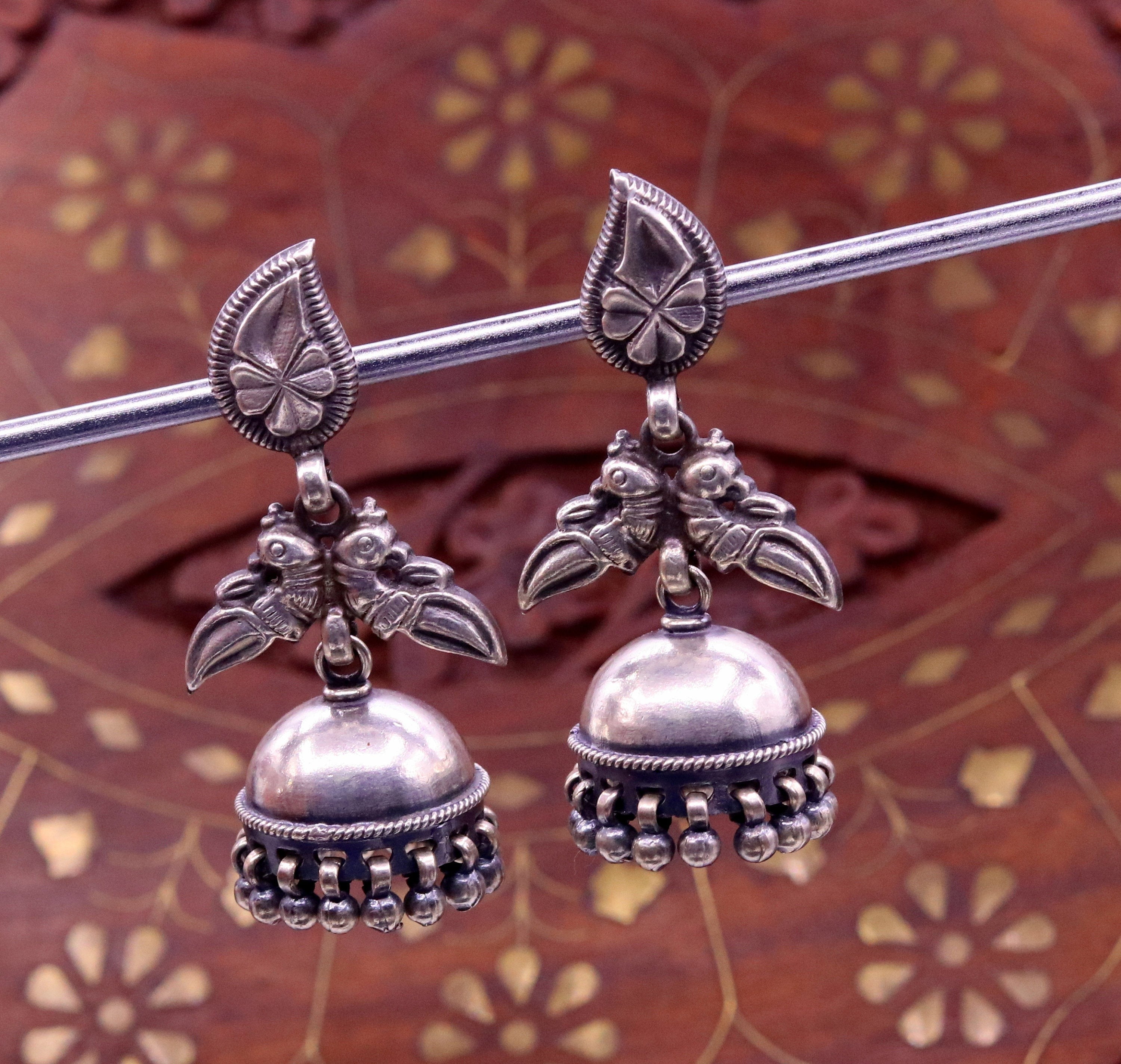 Oxidized silver color black polish light weight pink stone jhumka earrings  - Cardinal Jewellerry - 4268845