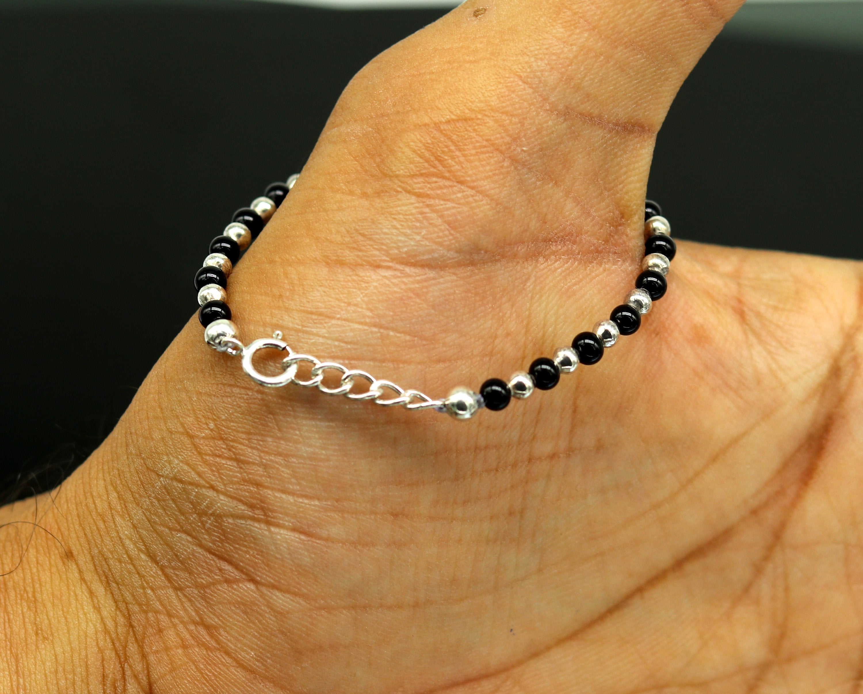 Little black hand on sale bracelet for babies