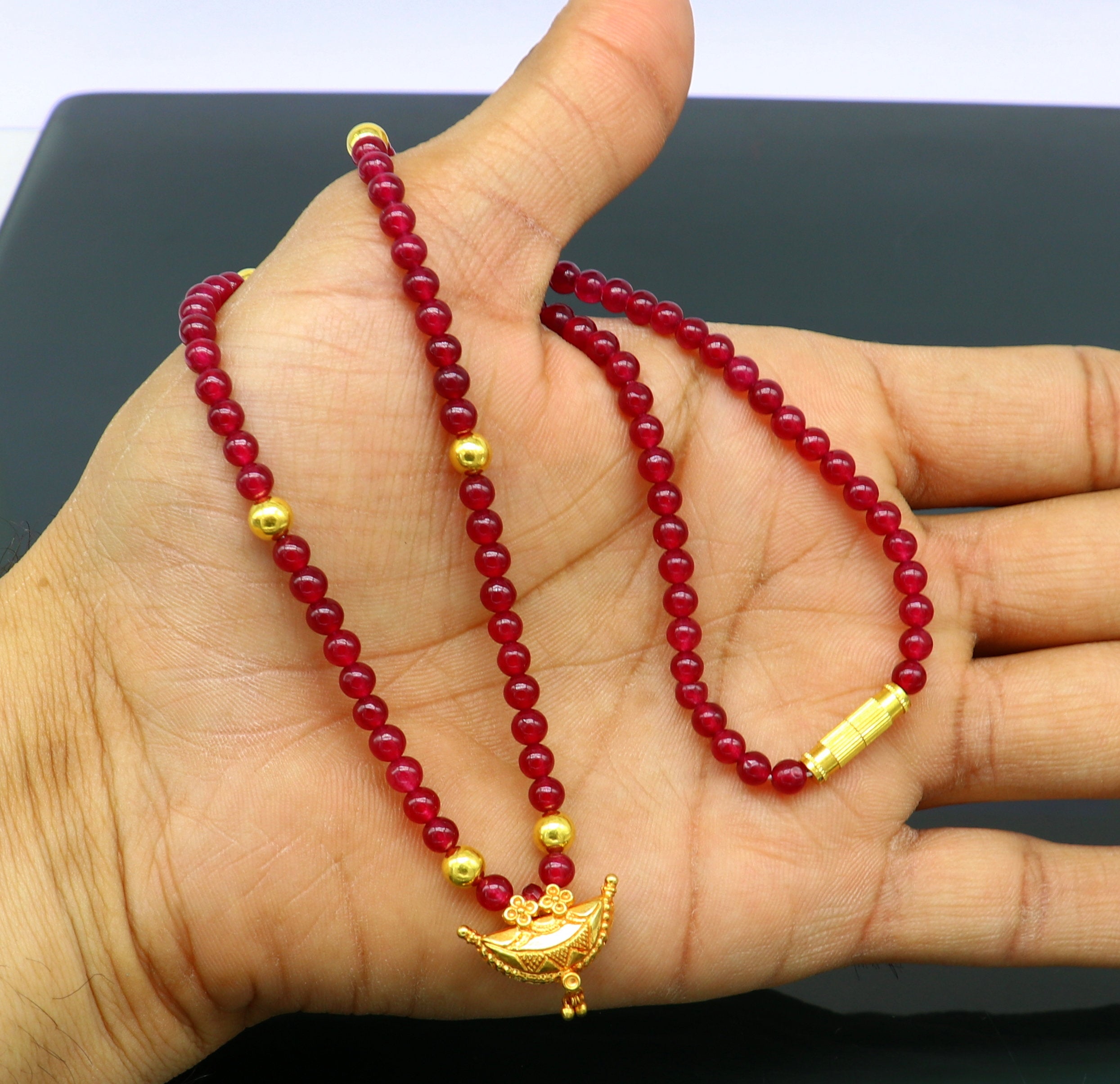 Red beads necklace with shop gold pendant