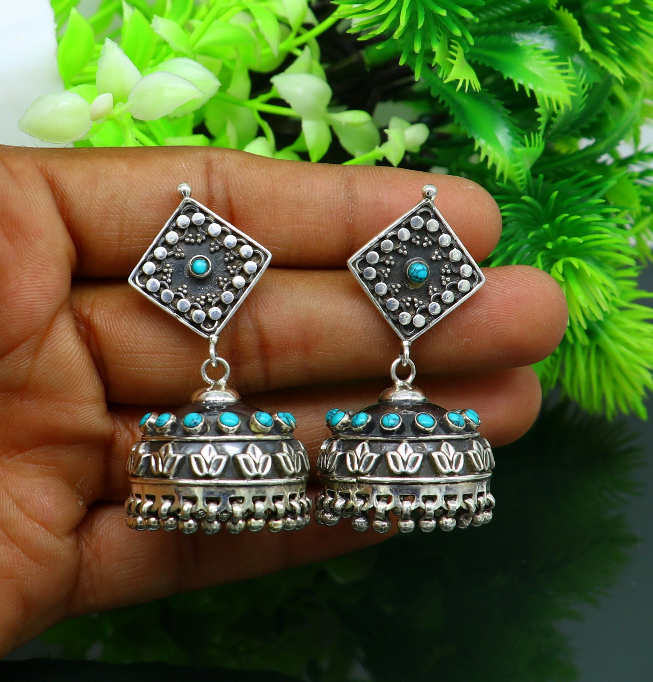 Embrace timeless elegance with the Designer Silver Indowestern Jhumka  Earrings. Combining traditional charm and modern flair,