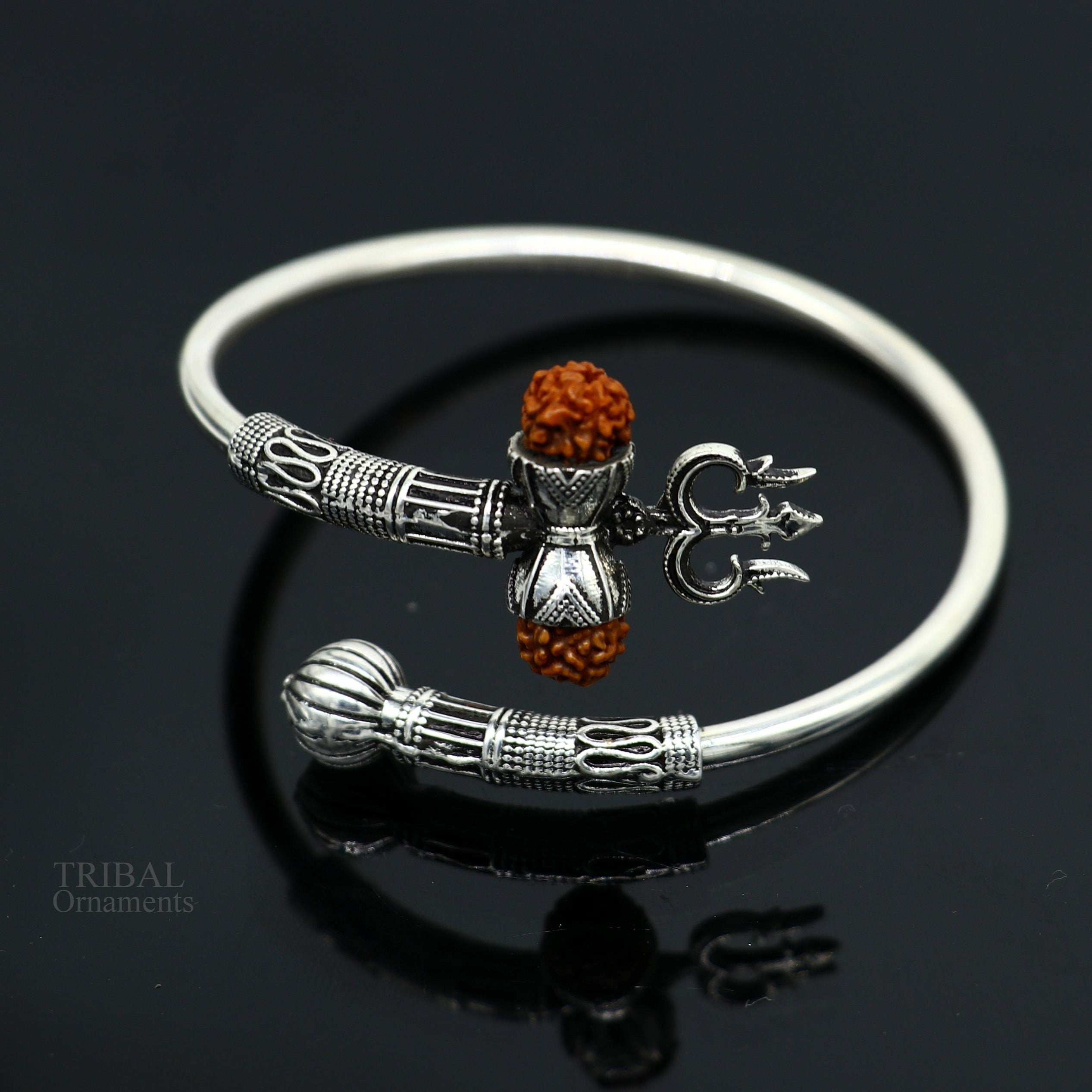 Amazon.com: AeraVida Spiritual Eye of Shiva Shell Sterling Silver on Black  Cotton Rope Adjustable Wrist Pull Bracelet: Clothing, Shoes & Jewelry