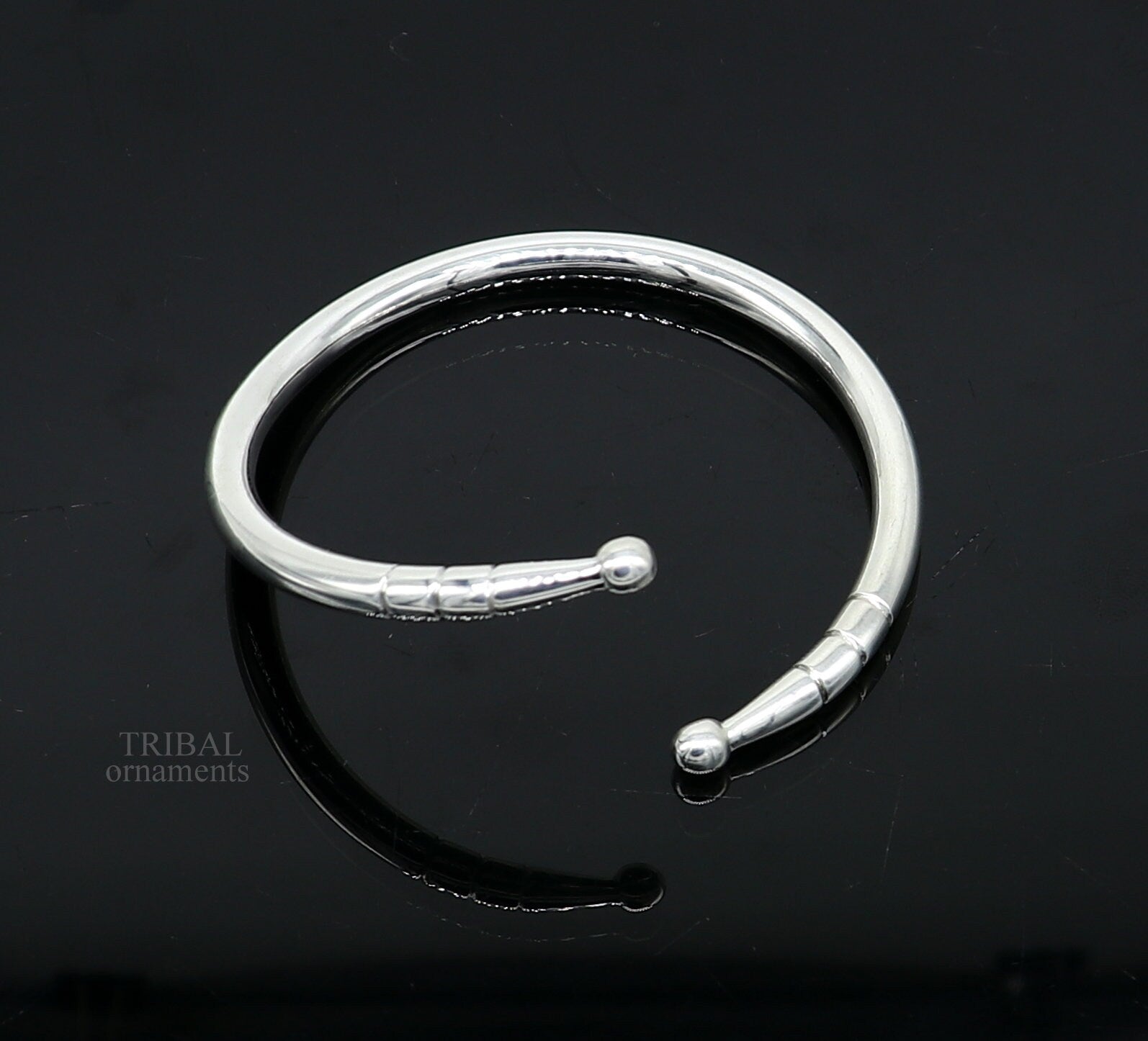 Twisted silver hoop bracelet by KristinM - Jedeco Jewellery Designers  Collective