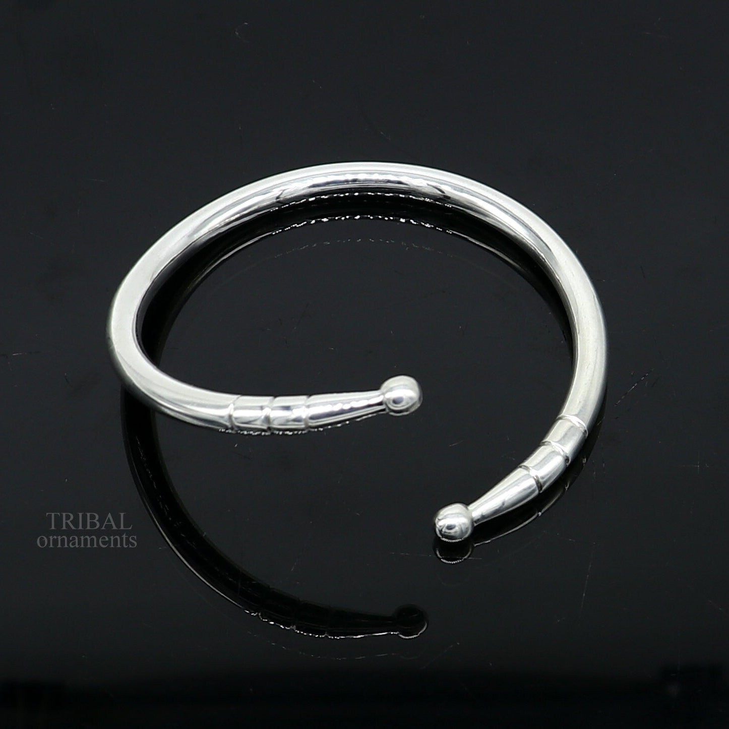 Twisted silver hoop bracelet by KristinM - Jedeco Jewellery Designers  Collective