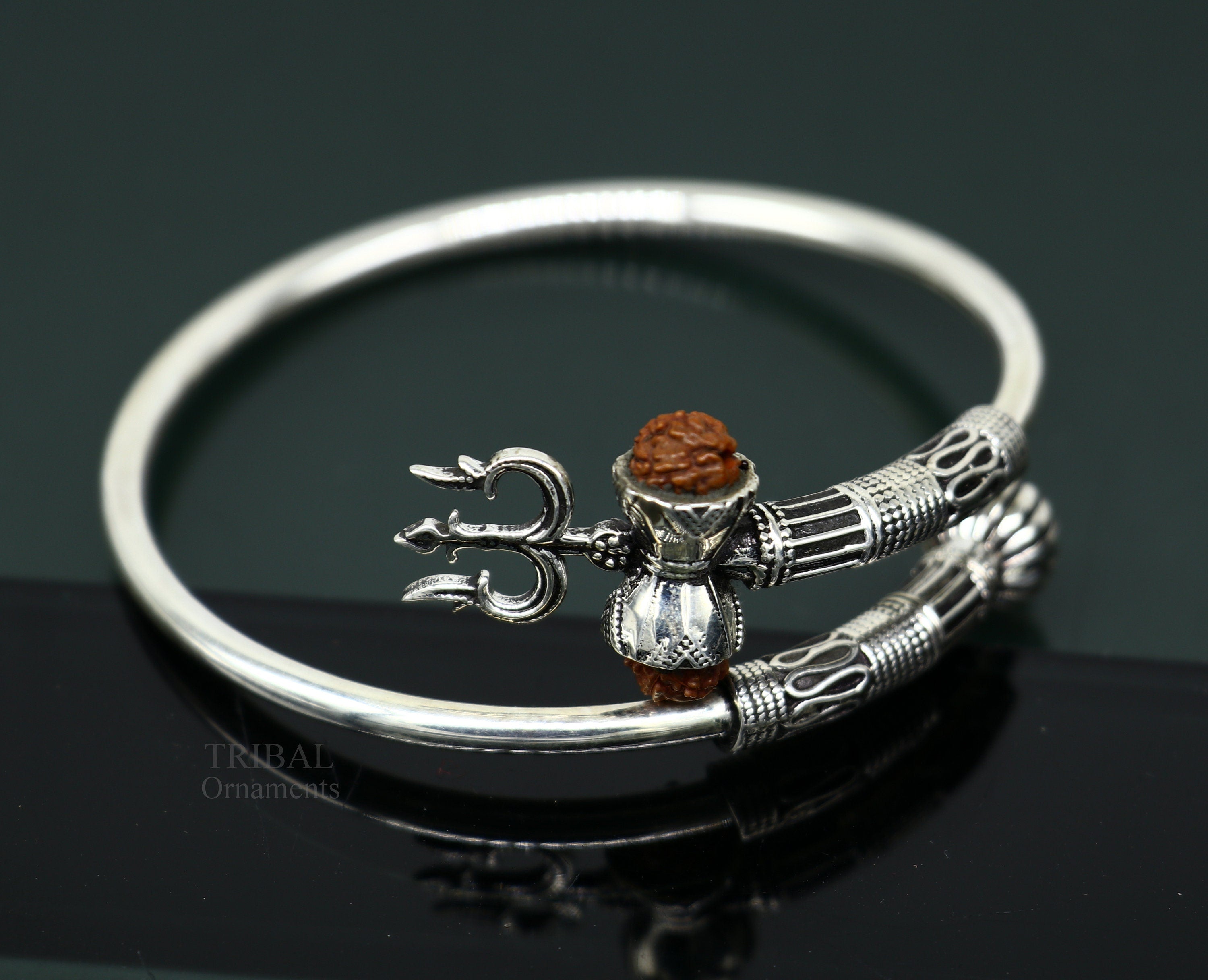 Amazon.com: AeraVida Spiritual Eye of Shiva Shell Sterling Silver on Black  Cotton Rope Adjustable Wrist Pull Bracelet: Clothing, Shoes & Jewelry