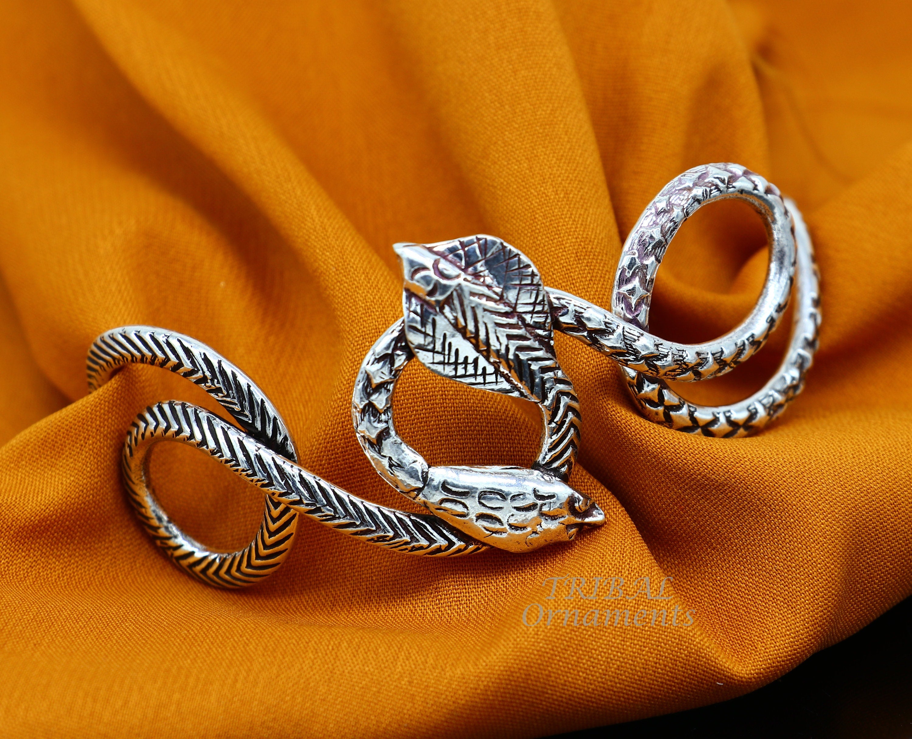 CABLE double bypass bracelet with snake shaped ends in stainless steel by  Taormina Jewelry