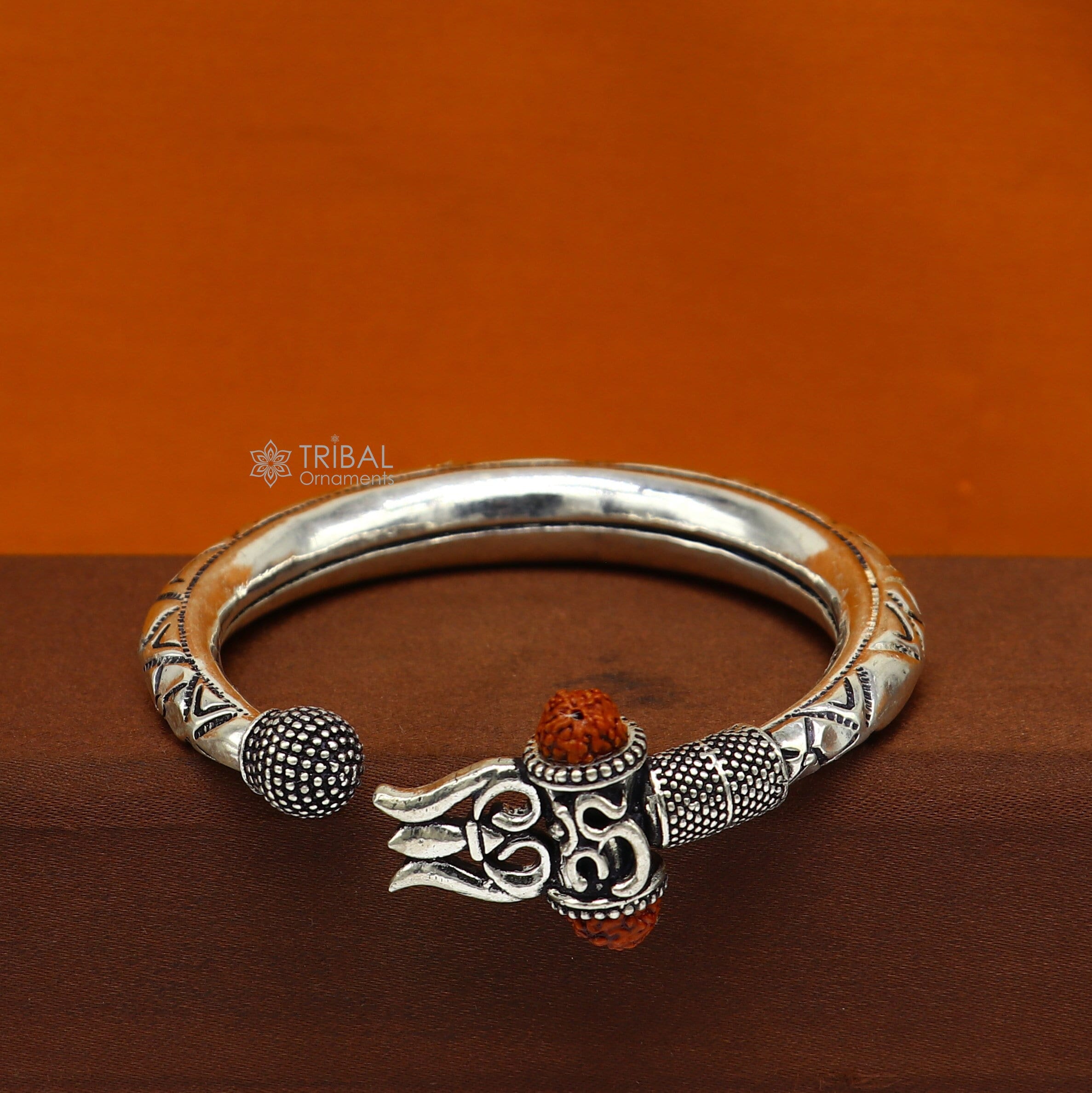 B18491 Blackish Silver Plated Watch Type Thick Kada Bracelet Ruby Stones |  JewelSmart.in