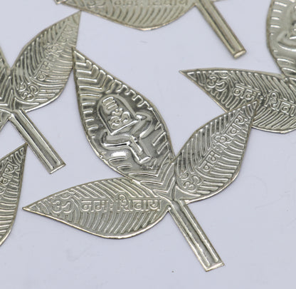 Three solid silver Belva Patra leaves for Shiva worship, handmade by Tribal Ornaments, traditional puja article for spiritual rituals.