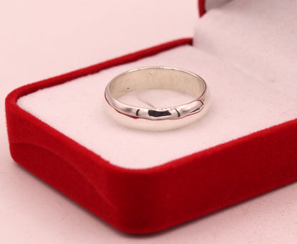 6mm 925 silver ring band by Tribal Ornaments, unisex engagement or wedding ring with custom sizing, showcasing a sleek, polished design.