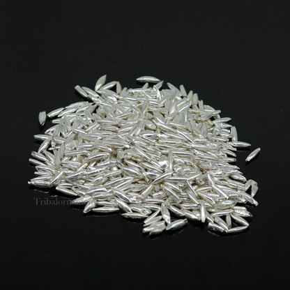 Tiny 999 silver rice Akshat and chawal for puja, traditional Indian silver worship articles from Tribal Ornaments.