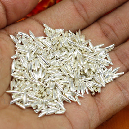 Tiny 999 silver rice Akshat and chawal for puja, traditional Indian worship silver article, from Tribal Ornaments, small silver nuts.