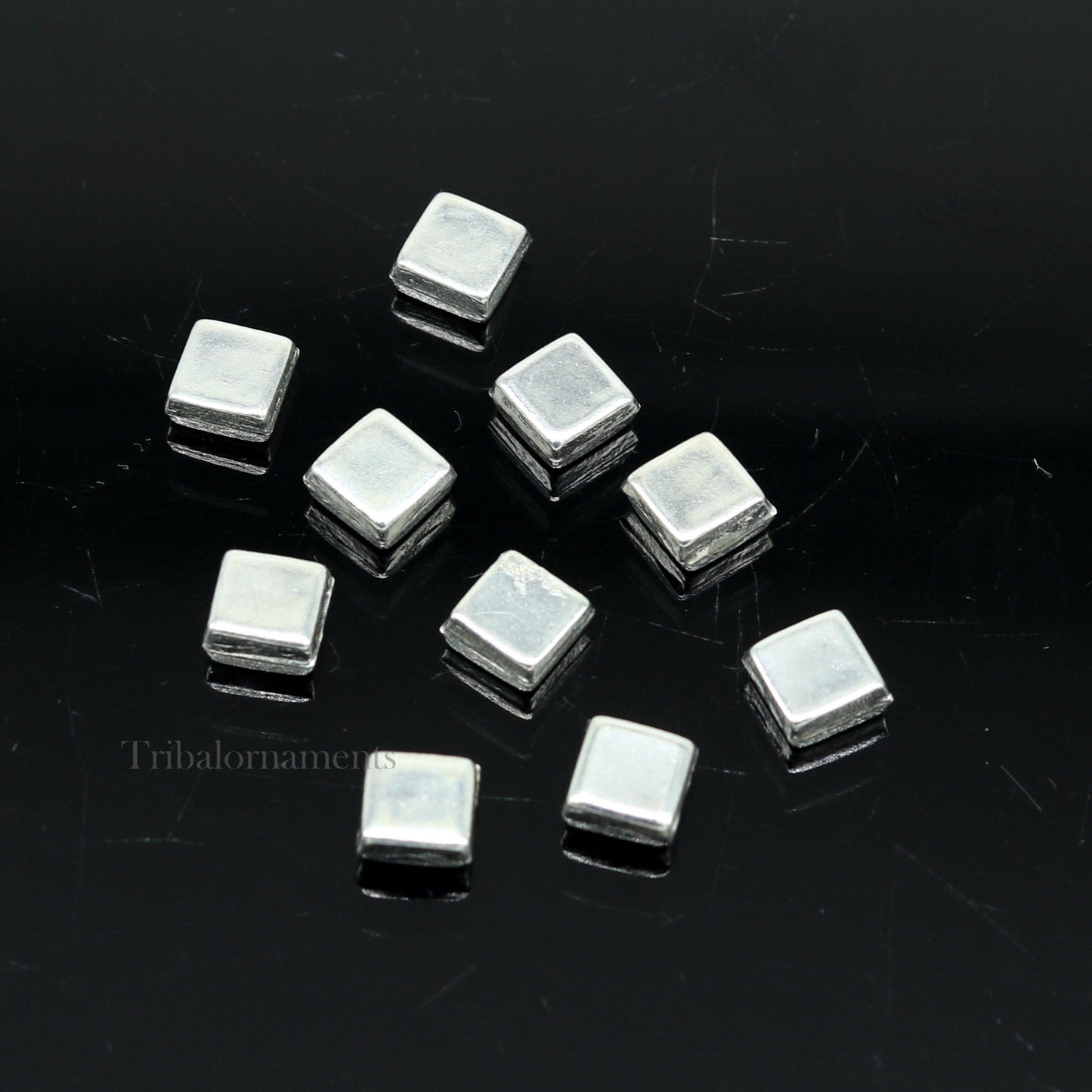 Tiny silver Barfi sweets for Diwali puja, traditional Indian silver prasadam, made by TRIBAL ORNAMENTS, for worship and offerings.