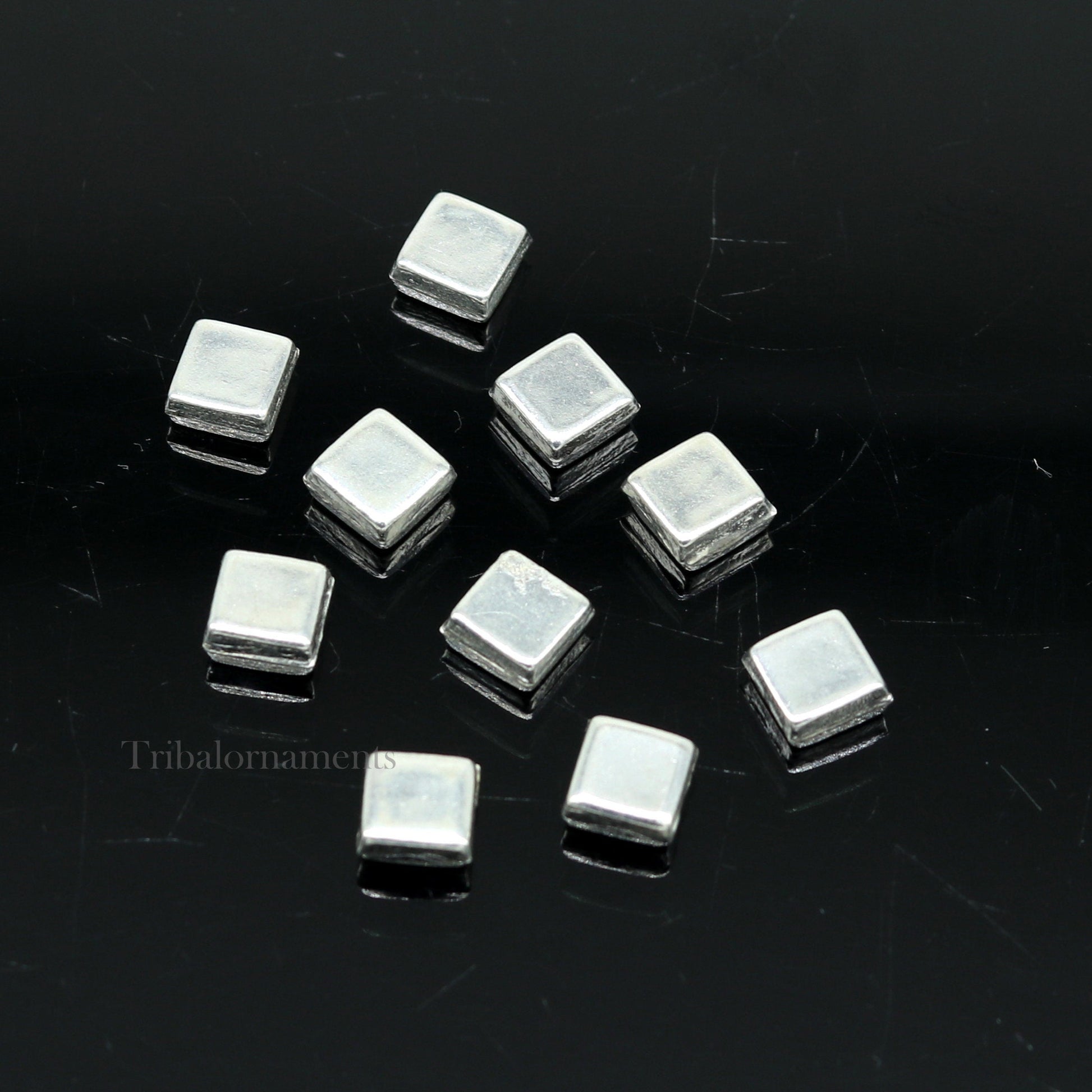 Tiny silver Barfi sweets for Diwali puja, traditional Indian silver prasadam, made by TRIBAL ORNAMENTS, for worship and offerings.