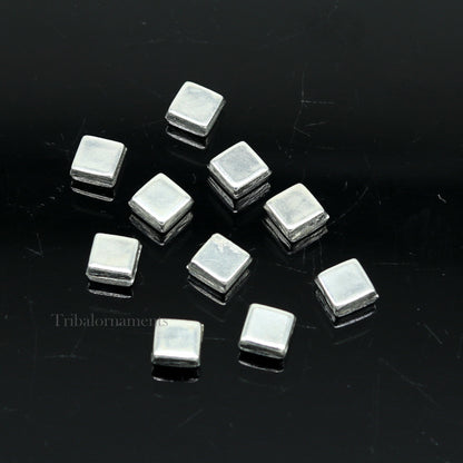 Tiny silver Barfi sweets for Diwali puja, traditional Indian silver prasadam, made by TRIBAL ORNAMENTS, for worship and offerings.