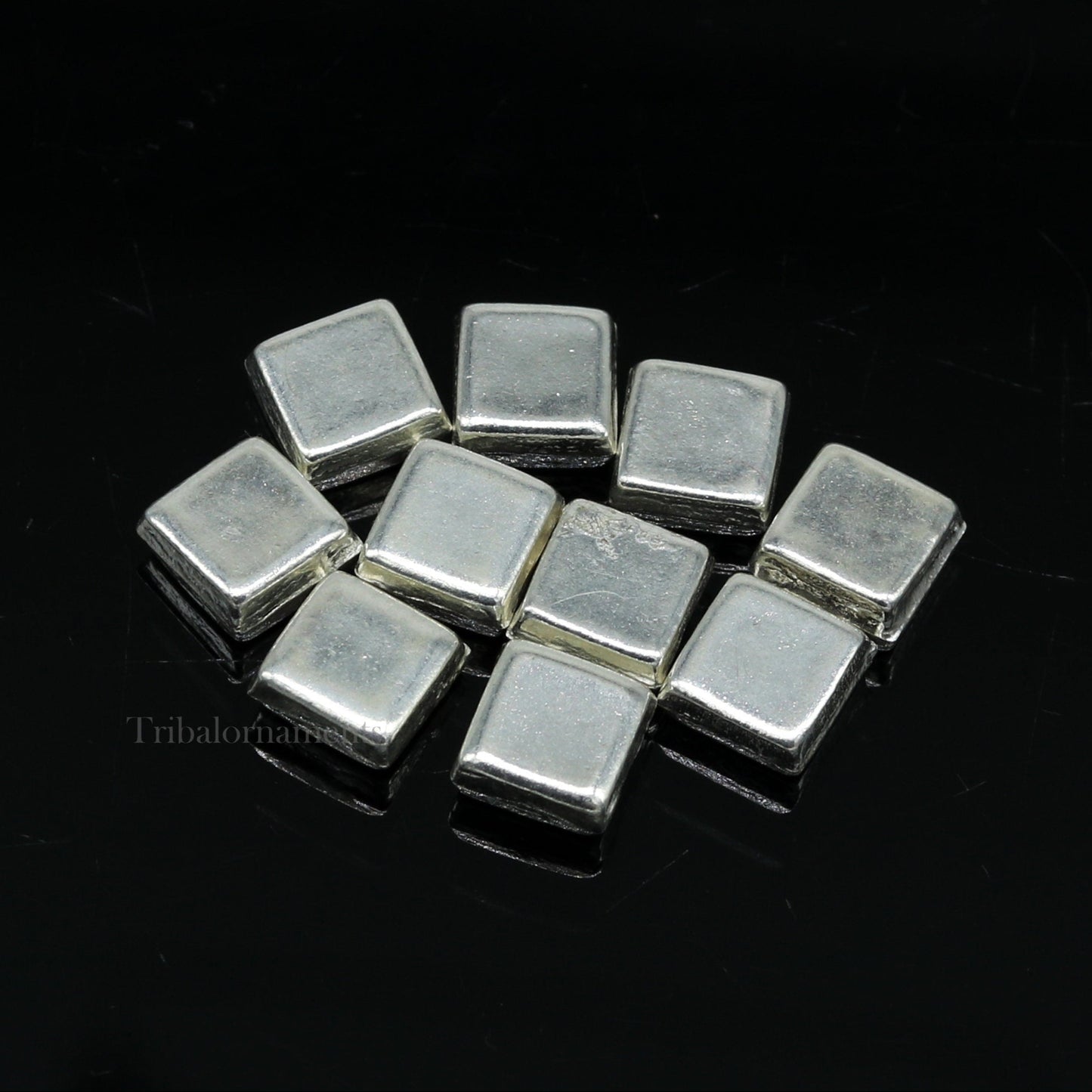 Tiny silver Barfi sweets for Diwali puja, traditional silver prasadam from India, crafted by TRIBAL ORNAMENTS.