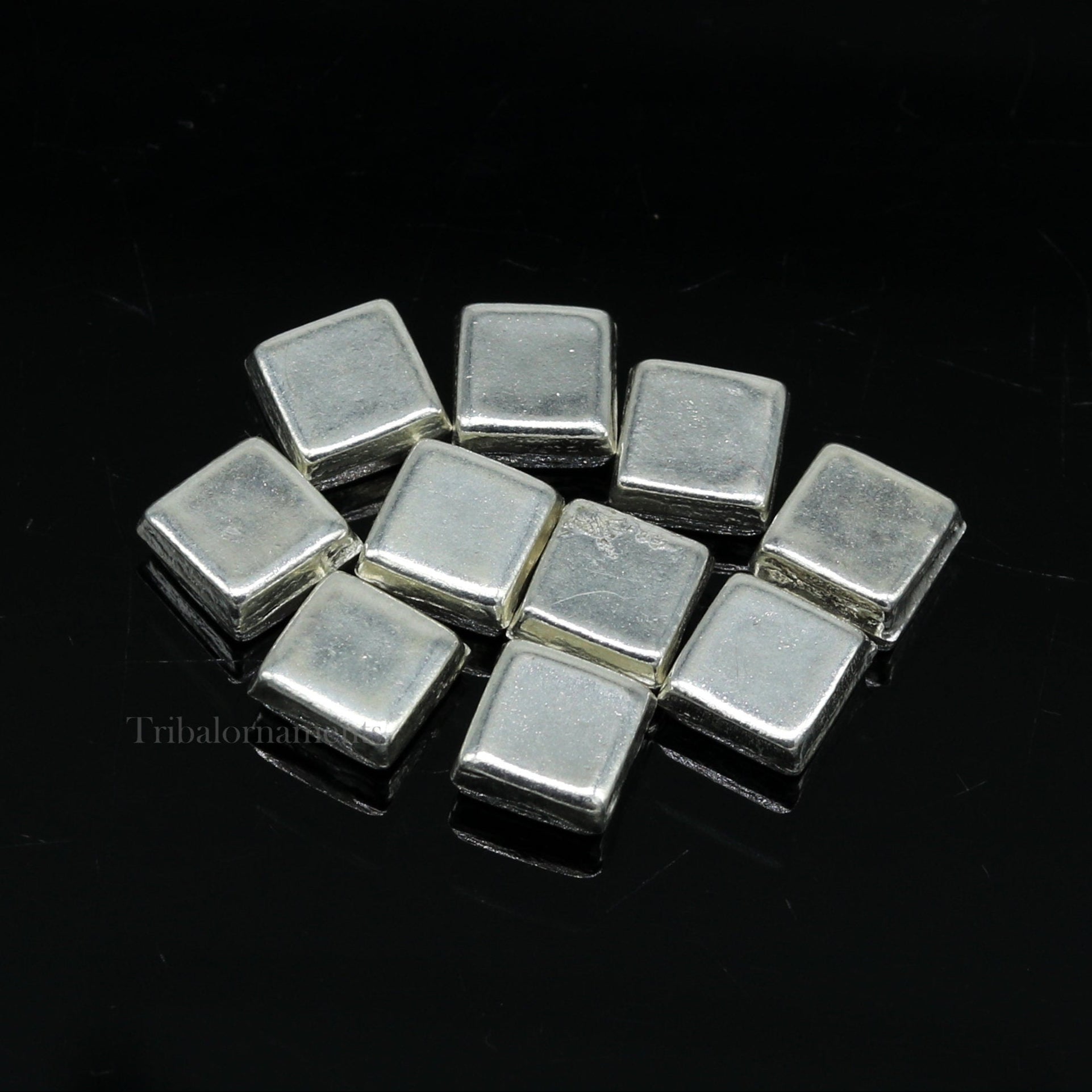 Tiny silver Barfi sweets for Diwali puja, traditional silver prasadam from India, crafted by TRIBAL ORNAMENTS.