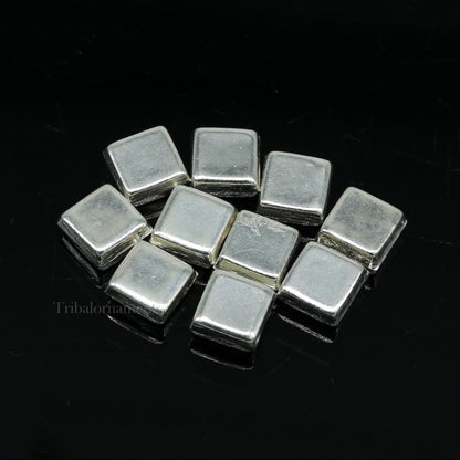 Tiny silver Barfi sweets for Diwali puja, traditional silver prasadam from India, crafted by TRIBAL ORNAMENTS.