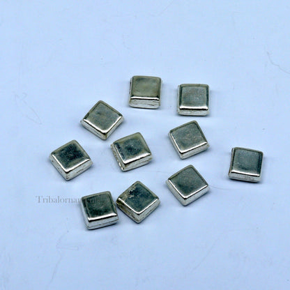 Silver Barfi sweets and silver cake Prasadam for Diwali puja, small silver worshipping article from Tribal Ornaments, India.