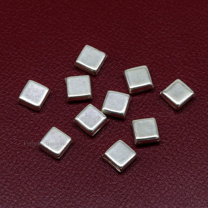 Silver Barfi sweets and tiny silver prasadam for Diwali puja, displayed as worshipping silver articles from Tribal Ornaments.