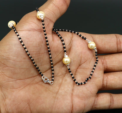 Sterling silver black beaded chain necklace with white pearls from Tribal Ornaments, elegant tribal jewelry set with intricate design.