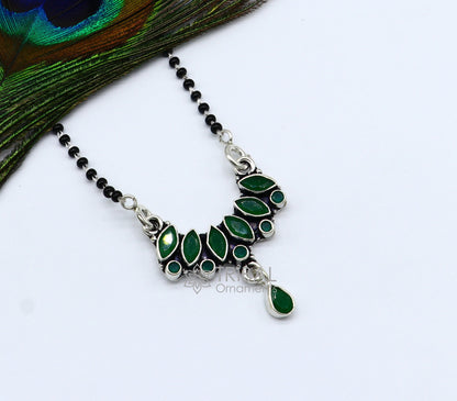 925 sterling silver black beads chain Mangalsutra necklace with green stone pendant, designed for daily wear and traditional occasions.
