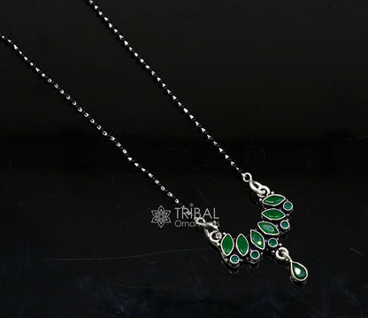 Sterling silver black beads Mangalsutra necklace with green stone pendant, tribal ornaments style, designed for daily wear or brides.