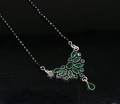 925 sterling silver black beads Mangalsutra necklace with green stone pendant, tribal-style daily wear jewelry for brides.