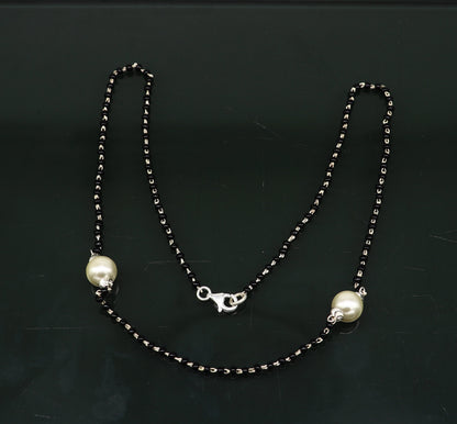 Sterling silver black beads and pearl beads Mangalsutra necklace set for brides with traditional Indian jewelry style.