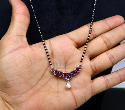 925 sterling silver black beads Mangalsutra necklace with pink stone and flower pendant from TRIBAL ORNAMENTS.