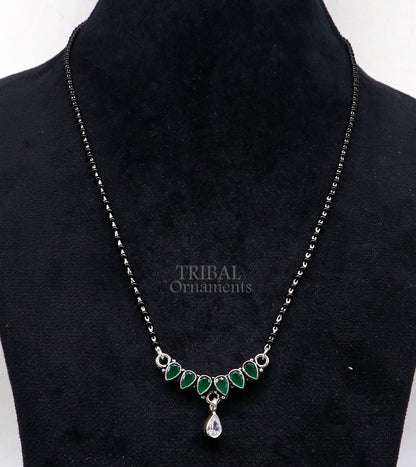 925 sterling silver black beads mangalsutra necklace with green stone and flower pendant, traditional tribal design for brides.