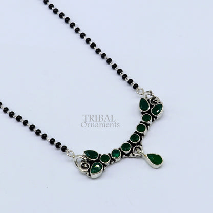 925 silver black beads and green stone Mangalsutra necklace by TRIBAL ORNAMENTS, featuring a chunky chain for special occasions.