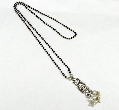Sterling silver tribal beaded chain necklace with floral design and pearl pendant, elegant mangalsutra for gifting.