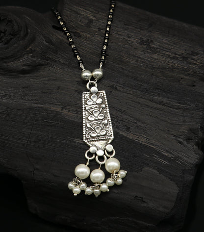 Sterling silver floral beaded chain necklace with pearl pendant, tribal-inspired design, ideal for gifting or special occasions.