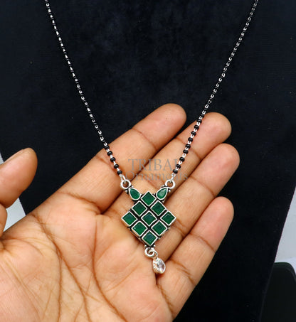 925 sterling silver mangasutra necklace with green stone pendant and black beads chain, traditional tribal jewelry design.