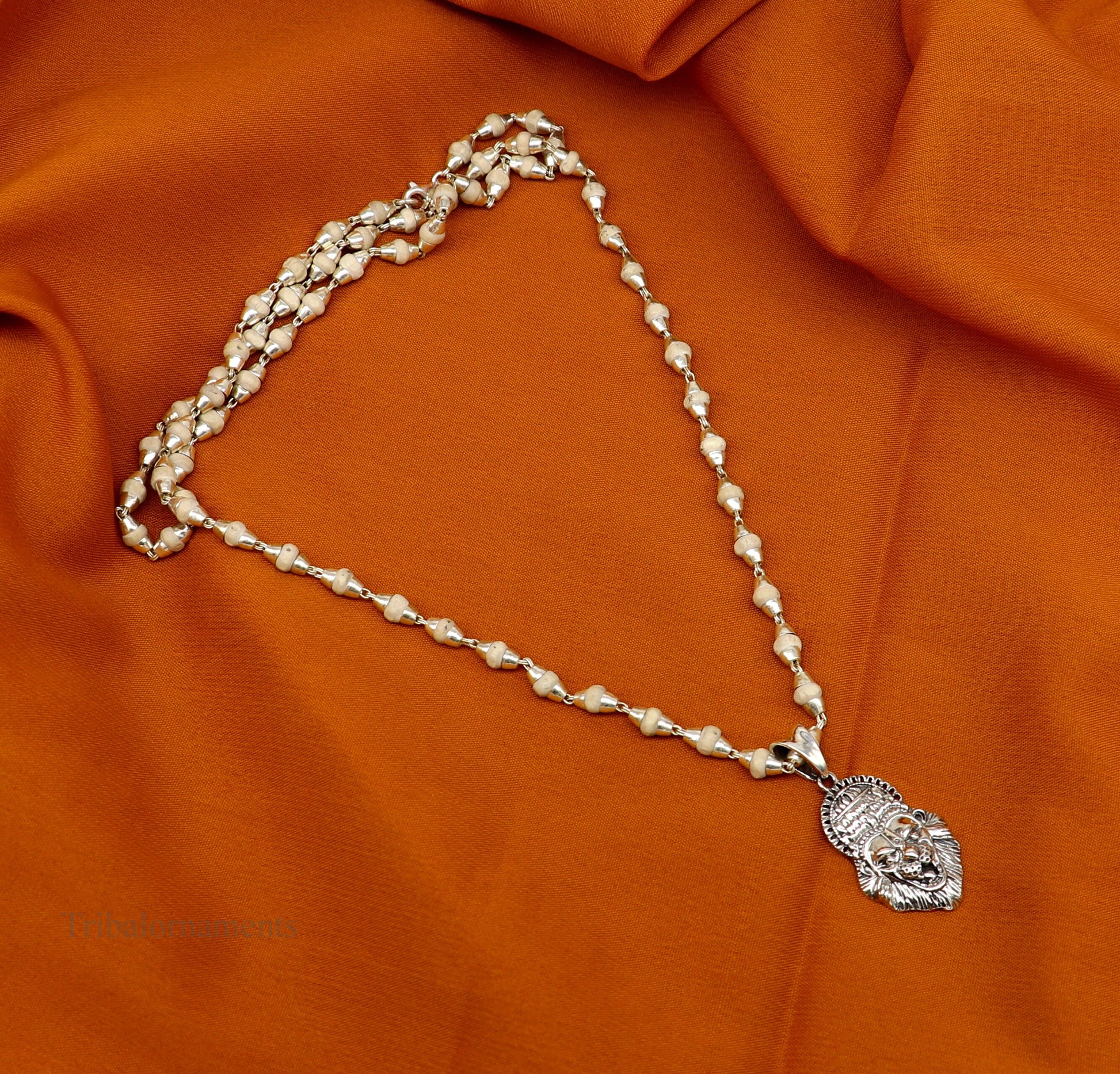 Holy Basil rosary with 4mm silver beads and Lord Vishnu Narsimha pendant, featuring a Tulsi mala set from Tribal Ornaments.