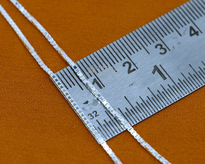 Sterling silver 1mm trendy box chain necklace by TRIBAL ORNAMENTS, showcasing a handmade, sleek, and versatile jewelry piece.
