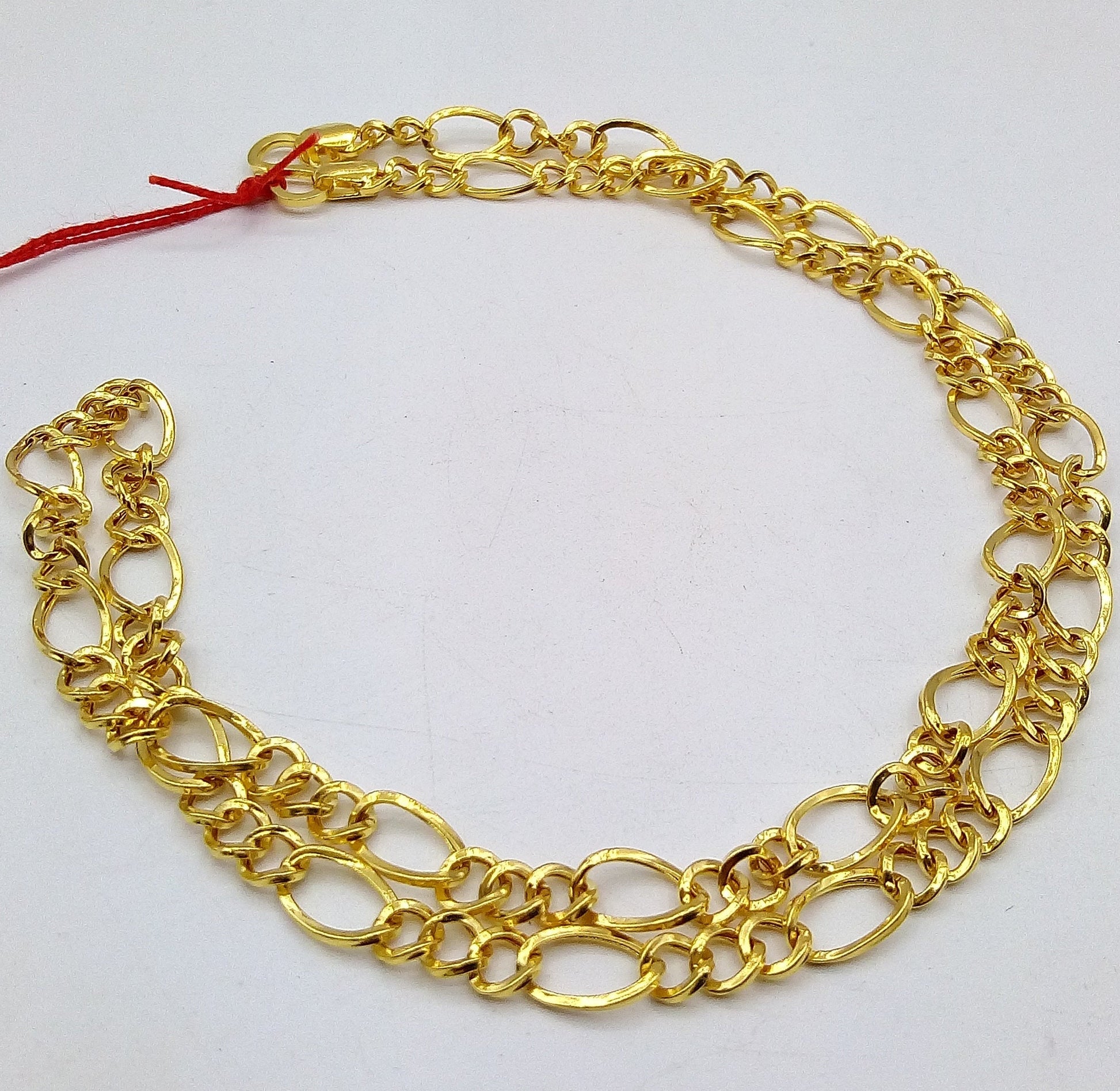 22K yellow gold handmade Figaro link chain necklace by TRIBAL ORNAMENTS, lightweight unisex design with certified 916 hallmark.