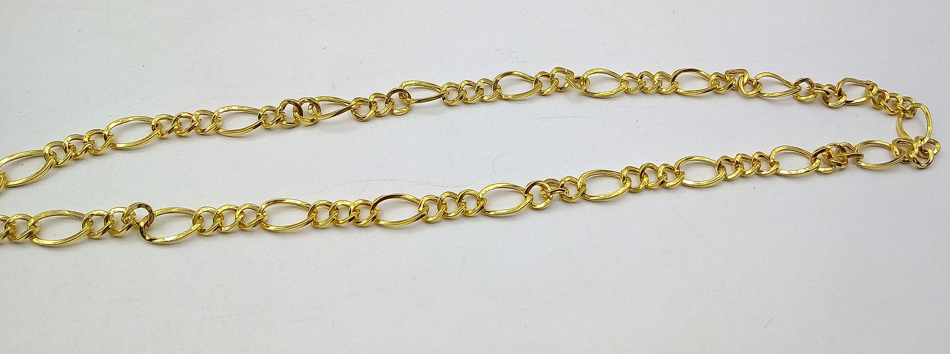 22K yellow gold handmade Figaro link chain necklace by TRIBAL ORNAMENTS, lightweight unisex design with hallmarked certification.