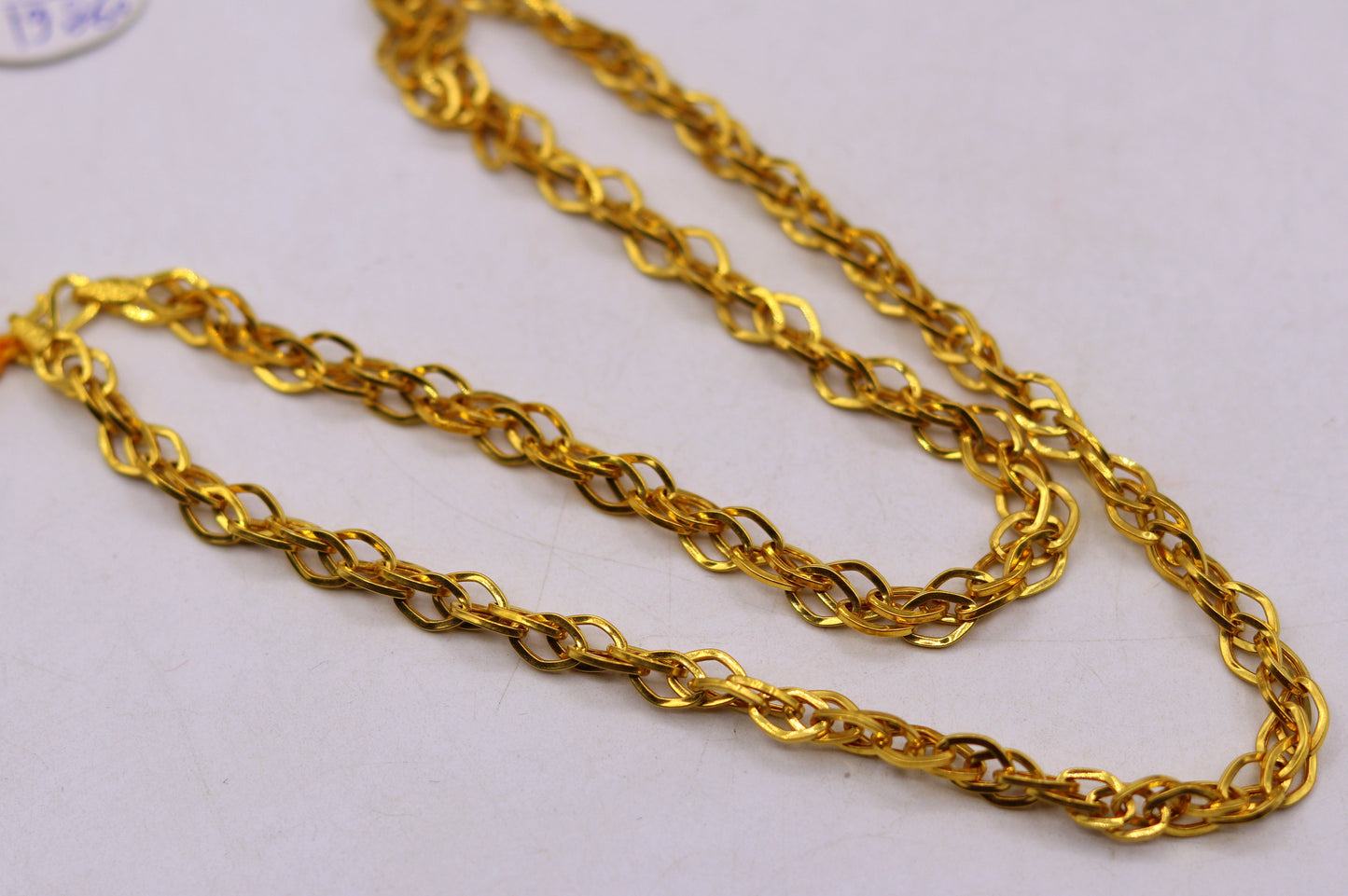 22K yellow gold handmade multi-link chain necklace by TRIBAL ORNAMENTS, unisex solid gold jewelry with intricate links.