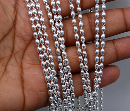 Sterling silver 3mm beaded chain necklace by TRIBAL ORNAMENTS, showcasing delicate craftsmanship and graceful movement.