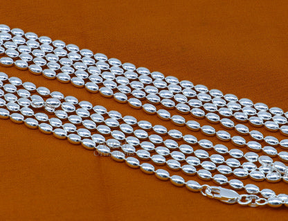 Sterling silver 3mm beaded baht chain necklace by TRIBAL ORNAMENTS, featuring delicate handmade design for graceful movement.